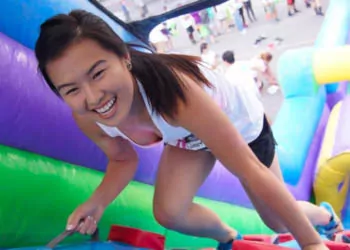 Girl climbing inflatable party rental from Jumptastic in Bethlehem, GA