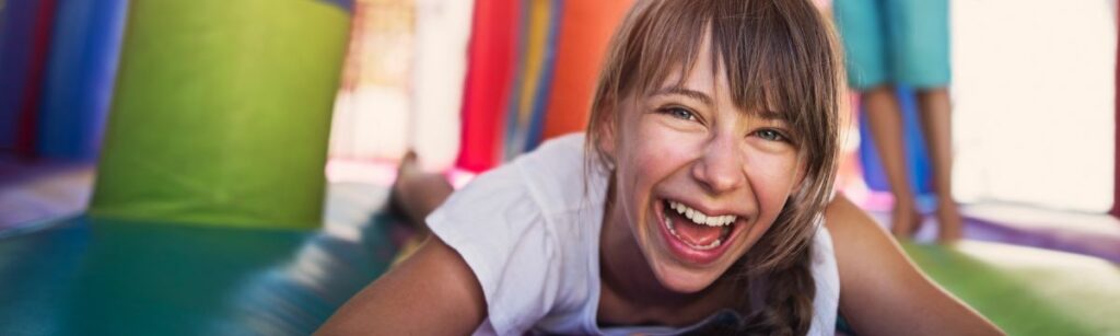 Girl having fun on Bounce House Rental from Jumptastic in Lawrenceville