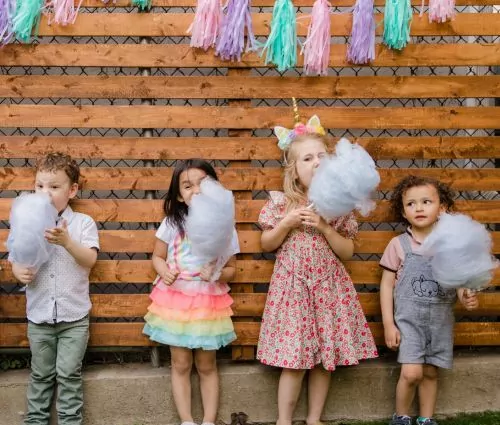 Kids enjoying cotton candy - concession machine rentals from Jumptastic