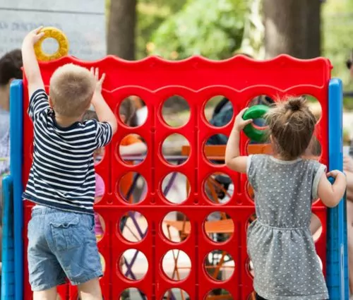 Kids playing Giant Connect 4 carnival game rental from Jumptastic, Atlanta, GA