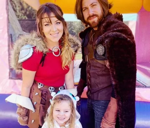 Local family posing in front of bounce house