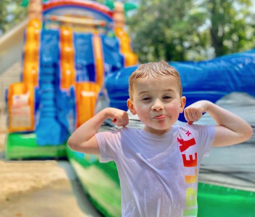 Boy Posing In Front Of Water Slide Rental At A Local Lebanon, Ga Event